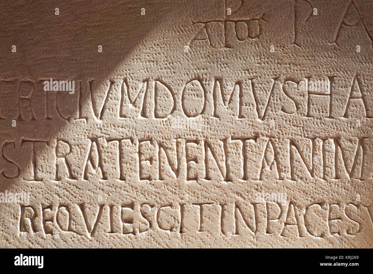 Closeup of a Latin 'Rest in Peace' inscription on a catacomb tomb underneath the Basilica Santa Maria della Sanita in Naples, Italy Stock Photo