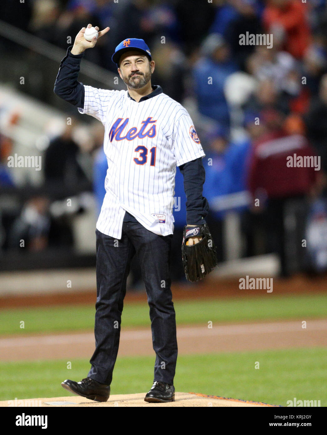 NEW YORK, NY - OCTOBER 18: Television host Jimmy Kimmel waves to the crowd prior to his first pitch before game two of the 2015 MLB National League Championship Series between the Chicago Cubs and the New York Mets at Citi Field on October 18, 2015 in the Flushing neighborhood of the Queens borough of New York City.   People:  Jimmy Kimmel Stock Photo