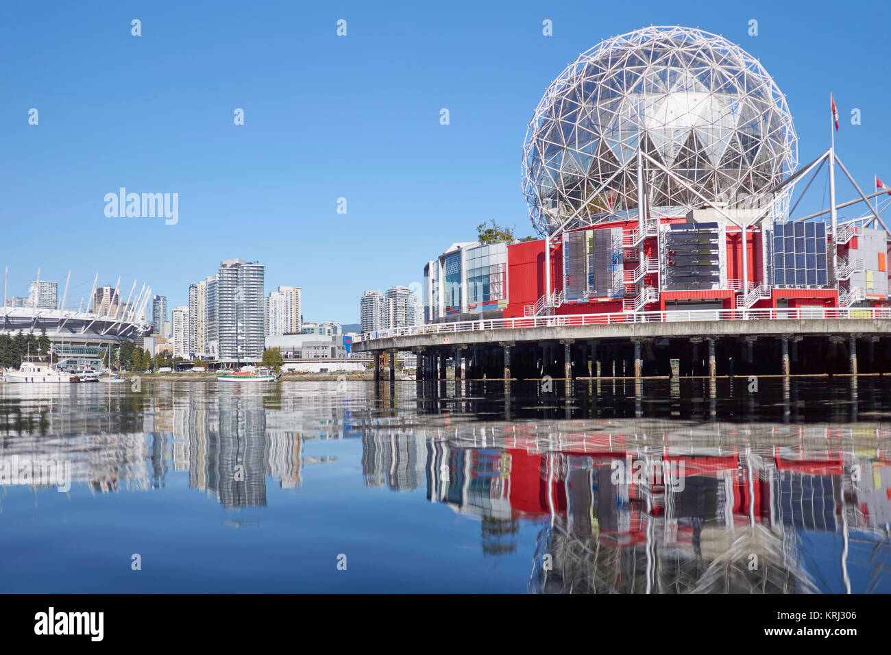 'Science World at Telus World of Science', British Columbia's science center - reflections of the buildings over False Creek, Vancouver, Canada Stock Photo