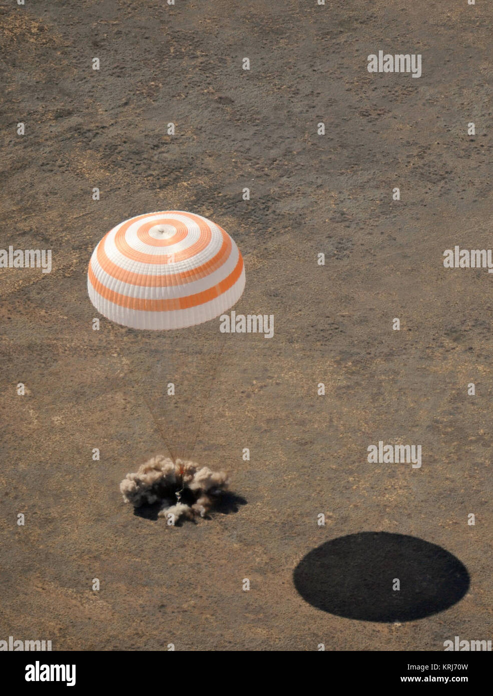 The Soyuz TMA-13 spacecraft, carrying Expedition 18 Commander Michael Fincke, Flight Engineer Yury V. Lonchakov and American Spaceflight Participant Charles Simonyi, lands, Wednesday, April 8, 2009, near Zhezkazgan, Kazakhstan.  Fincke and Lonchakov return after spending six months on the International Space Station, and Simonyi is returning from his launch with the Expedition 19 crew members twelve days earlier.  Photo Credit: (NASA/Bill Ingalls) Soyuz TMA-13 landing Stock Photo