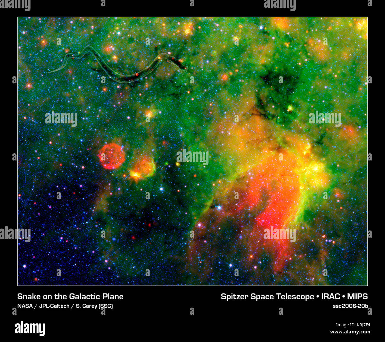 This infrared image from NASA's Spitzer Space Telescope shows what astronomers are referring to as a "snake" (upper left) and its surrounding stormy environment. The sinuous object is actually the core of a thick, sooty cloud large enough to swallow dozens of solar systems. In fact, astronomers say the "snake's belly" may be harboring beastly stars in the process of forming.The galactic creepy crawler to the right of the snake is another thick cloud core, in which additional burgeoning massive stars might be lurking. The colorful regions below the two cloud cores are less dense cloud material, Stock Photo