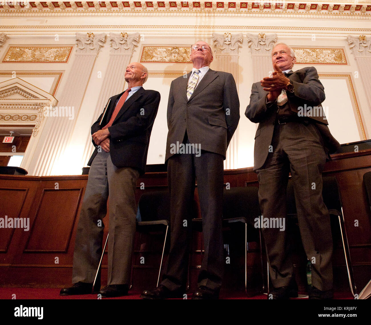 Apollo 11 Astronauts, from left, Michael Collins, Neil Armstrong, and Buzz Aldrin stand in recognition of Astronaut John Glenn during the U.S House of Representatives Committee on Science and Technology tribute to the Apollo 11 Astronauts at the Cannon House Office Building on Capitol Hill, Tuesday, July 21, 2009 in Washington.  The committee presented the three Apollo 11 astronauts with a framed copy of House Resolution 607 honoring their achievement, and announced passage of legislation awarding them and John Glenn the Congressional Gold Medal.  Photo Credit: (NASA/Bill Ingalls) Apollo 11 cr Stock Photo