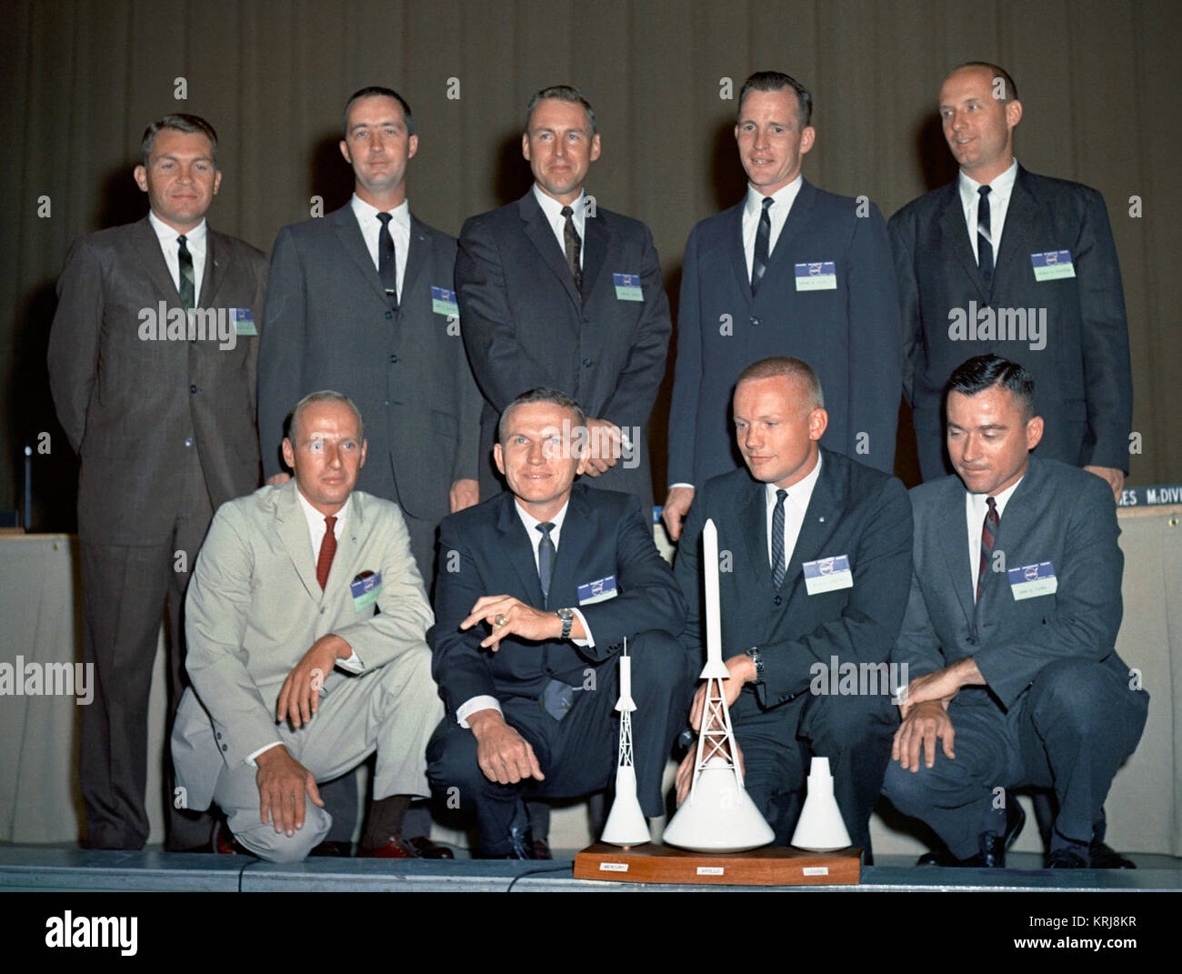 S62-06759 (1962) --- This is the second group of pilot astronauts chosen by the National Aeronautics and Space Administration (NASA).  These astronaut pilots are (kneeling left to right) Charles Conrad, Jr., Frank Borman, Neil A. Armstrong, and John W. Young; (standing in the back row - left to right) Elliot M. See, Jr., James A. McDivitt, James A. Lovell, Jr., Edward H. White II, and Thomas P. Stafford. Astronaut Group 2 - S62-6759 Stock Photo