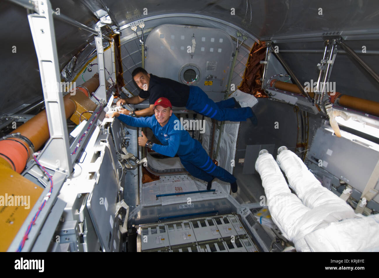 STS-128 Rick Sturckow and Jose Hernandez work in the Leonardo MPLM Stock Photo