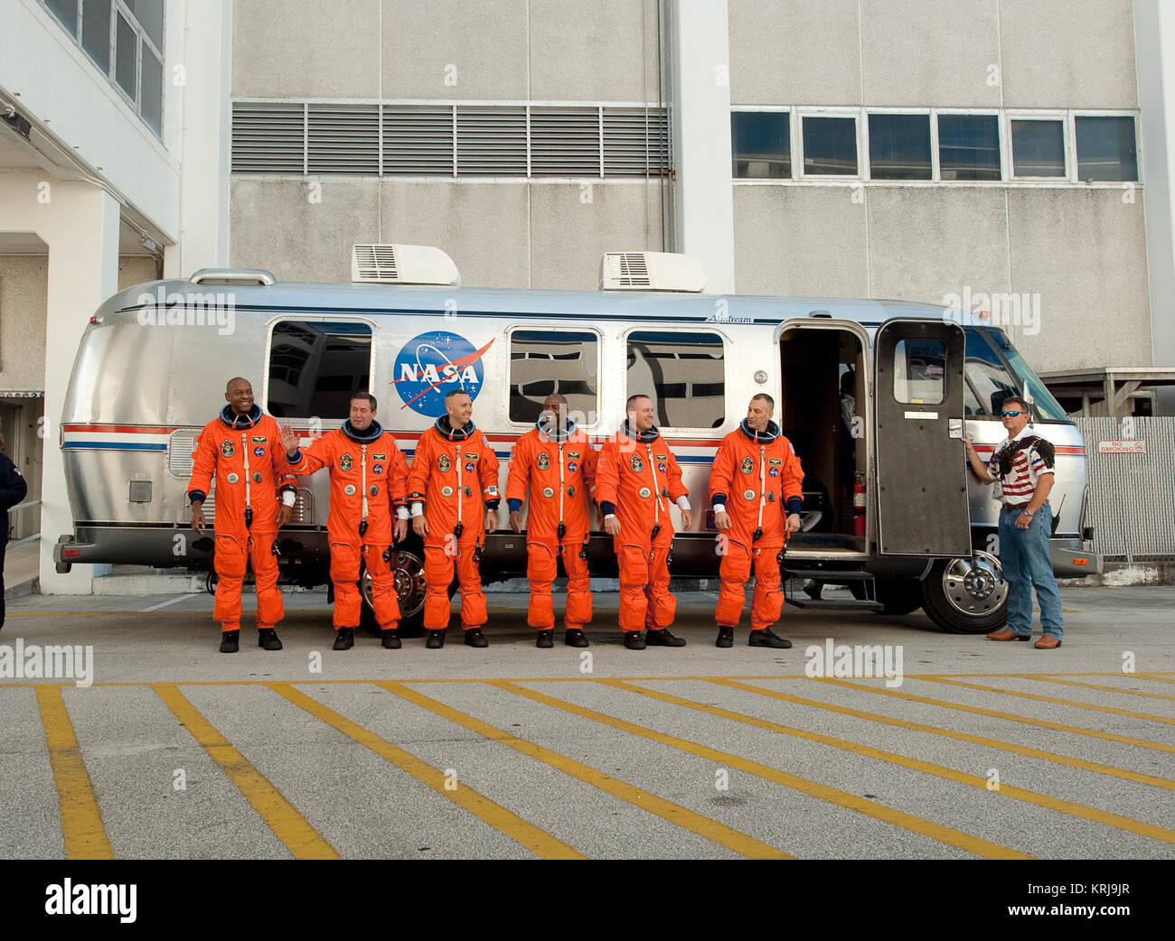 STS-129 crew members, from left, Robert Satcher, Mike Foreman, Randy Bresnik, Leland Melvin, Pilot Barry Wilmore, and Mission Commander Charlie Hobaugh stop and pose for a photograph before getting into the astrovan and heading to launch pad 39a at the NASA Kennedy Space Center in Cape Canaveral, Fl on Monday, Nov. 16, 2009.  Photo Credit: (NASA/Bill Ingalls) STS-129 Crew Photo Astrovan Stock Photo