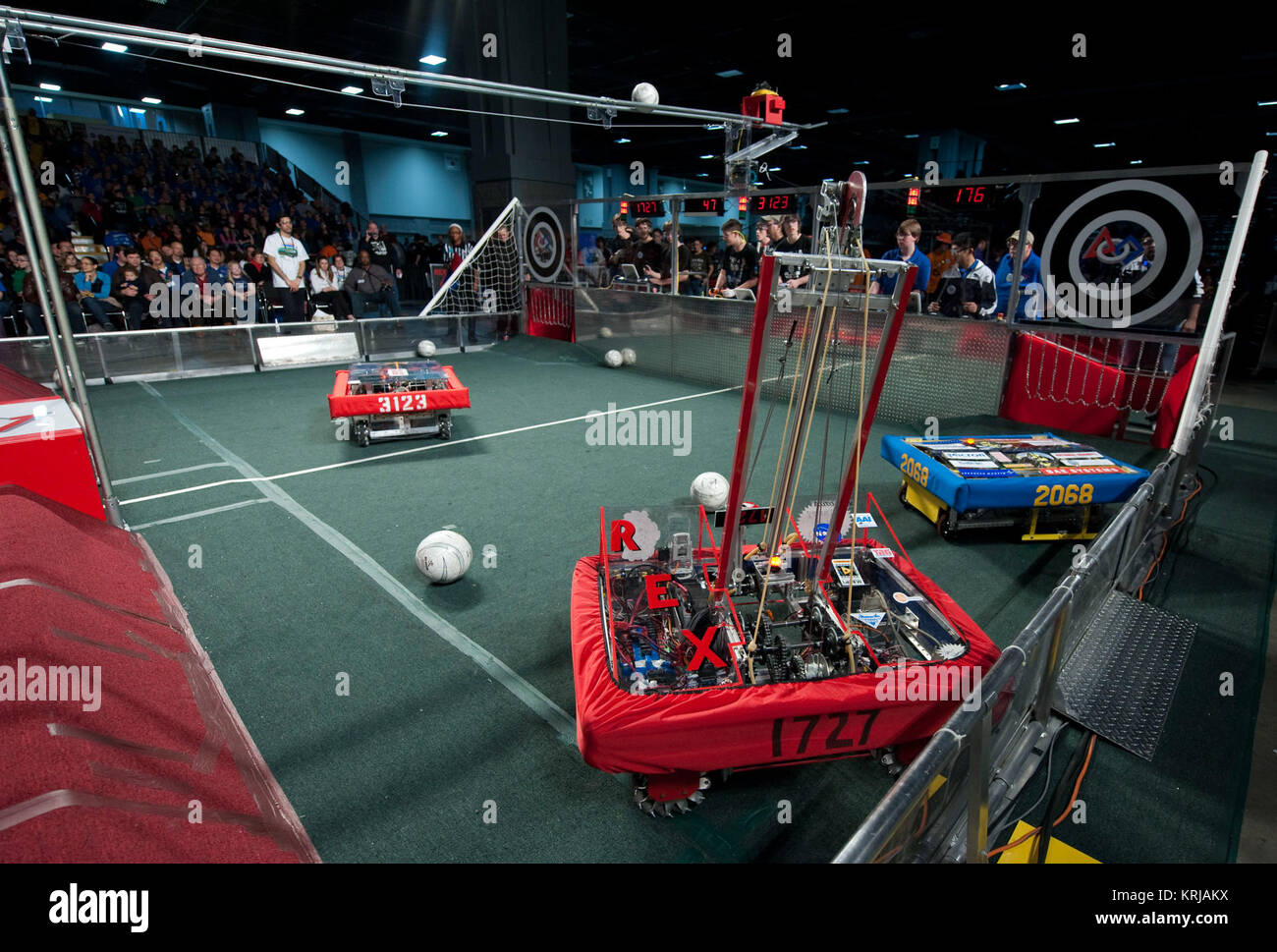 Robots work the playing field during the second day of competition at the First Robotics Competition, Saturday, March 6, 2010, in Washington. The student competition is called 'For Inspiration and Recognition of Science and Technology', or FIRST. The program was founded in 1989 by Dean Kamen to inspire an appreciation of science and technology in young people, their schools and communities.  Photo Credit: (NASA/Paul E. Alers) First Robotics Competition (835838) Stock Photo