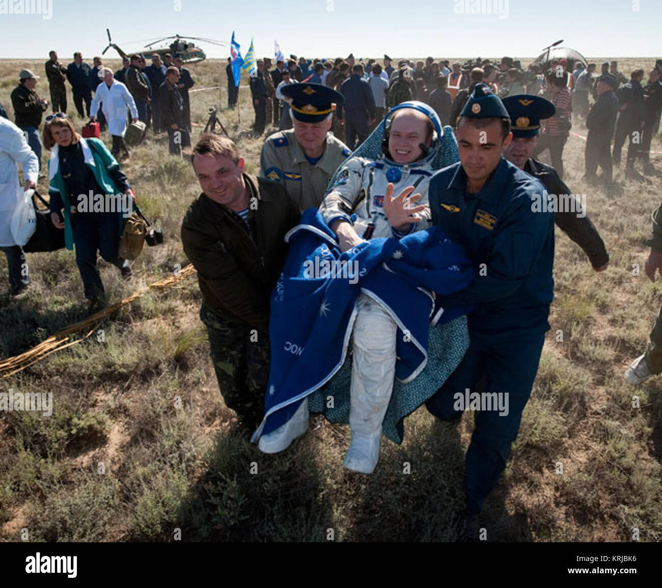Expedition 23 Commander Oleg Kotov is carried in a chair to the medical tent just minutes after he and fellow crew members T.J. Creamer and Soichi Noguchi landed in their Soyuz TMA-17 capsule near the town of Zhezkazgan, Kazakhstan on Wednesday, June 2, 2010. NASA Astronaut Creamer, Russian Cosmonaut Kotov and Japanese Astronaut Noguchi are returning from six months onboard the International Space Station where they served as members of the Expedition 22 and 23 crews. Photo Credit: (NASA/Bill Ingalls) Kotov28129 Stock Photo