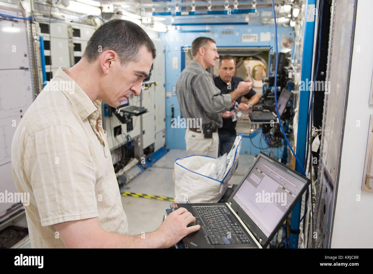PHOTO DATE: 09-20-10 LOCATION: Bldg 9NW, ISS Mockups SUBJECT:  Expedition 29 crew members Dan Burbank, Anton Shkaplerov and Anatoly Ivanishin during Routine Ops MS02 training with instructor Bill Frank. PHOTOGRAPHER: James Blair Anatoly Ivanishin JSC Stock Photo