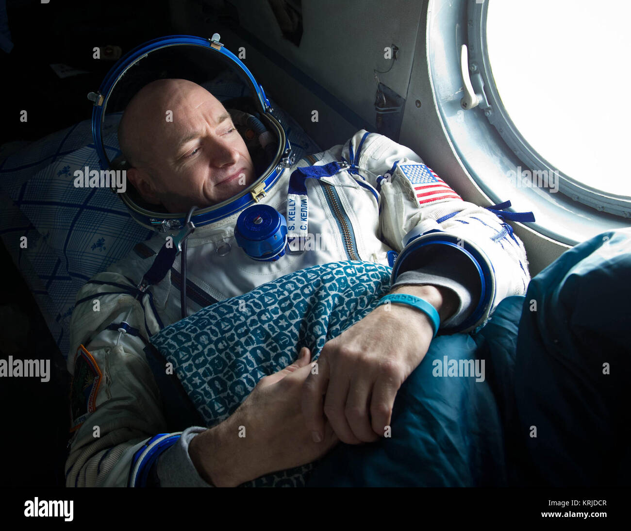 Expedition 26 Commander Scott Kelly looks out the window of a Russian Search and Rescue helicopter before the two hour helicopter ride to Kustanay, Kazakhstan shortly after he and fellow crew members Oleg Skripochka and Alexander Kaleri landed in their Soyuz TMA-01M capsule near the town of Arkalyk, Kazakhstan on Wednesday, March 16, 2011.  NASA Astronaut Kelly, Russian Cosmonauts Skripochka and Kaleri are returning from almost six months onboard the International Space Station where they served as members of the Expedition 25 and 26 crews. Photo Credit: (NASA/Bill Ingalls) Soyuz TMA-01M Scott Stock Photo