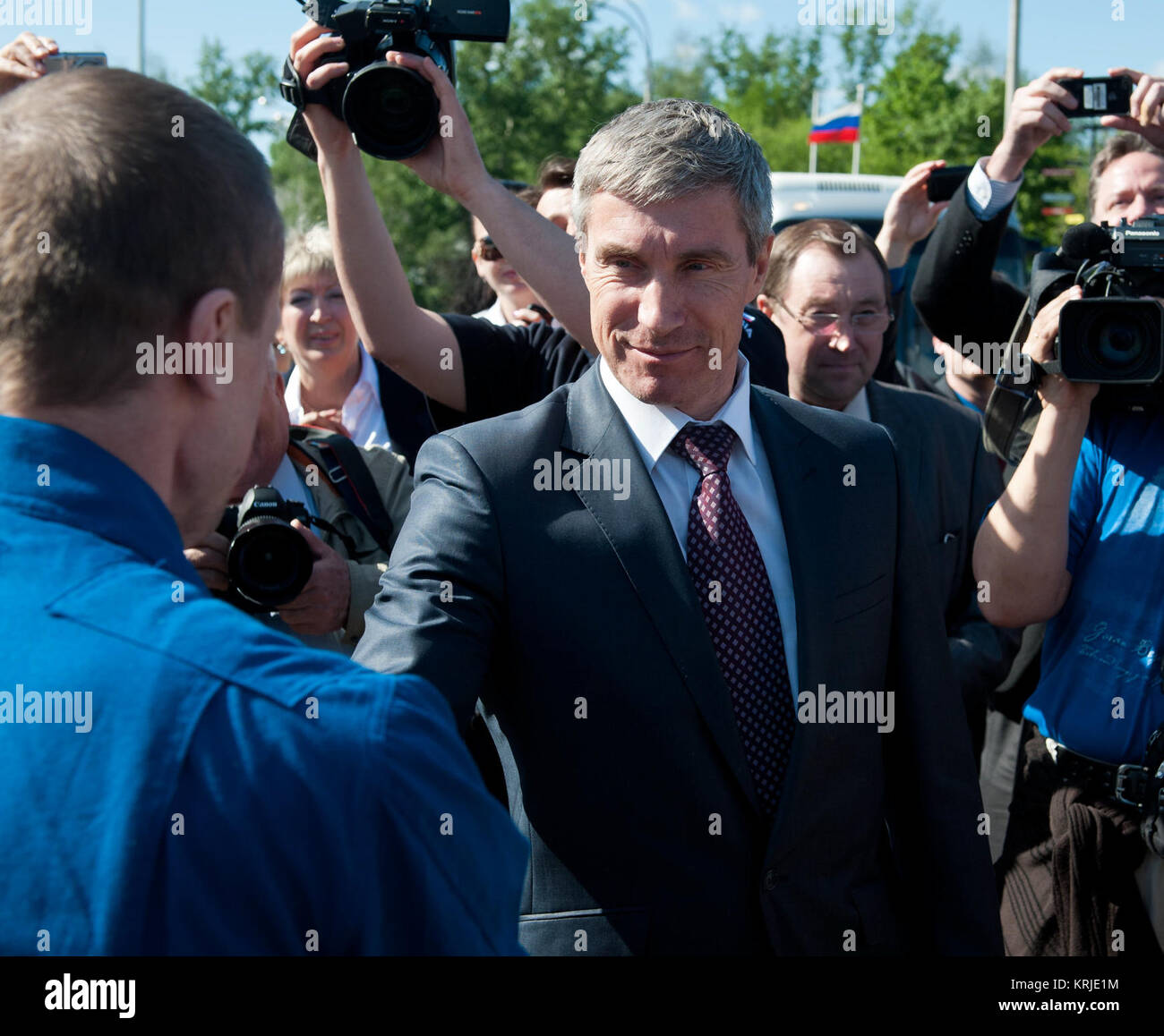 Chief, Gagarin Cosmonaut Training Center, Sergei Krikalev shakes hands and welcomes home Expedition 27 Commander Dmitry Kondratyev at the Chkalovsky airport outside Star City, Russia several hours after Kondratyev and Flight Engineers Paolo Nespoli and Cady Coleman landed in their Soyuz TMA-20 southeast of the town of Zhezkazgan, Kazakhstan, on Tuesday, May 24, 2011.  NASA Astronaut Coleman, Russian Cosmonaut Kondratyev and Italian Astronaut Nespoli are returning from more than five months onboard the International Space Station where they served as members of the Expedition 26 and 27 crews. P Stock Photo