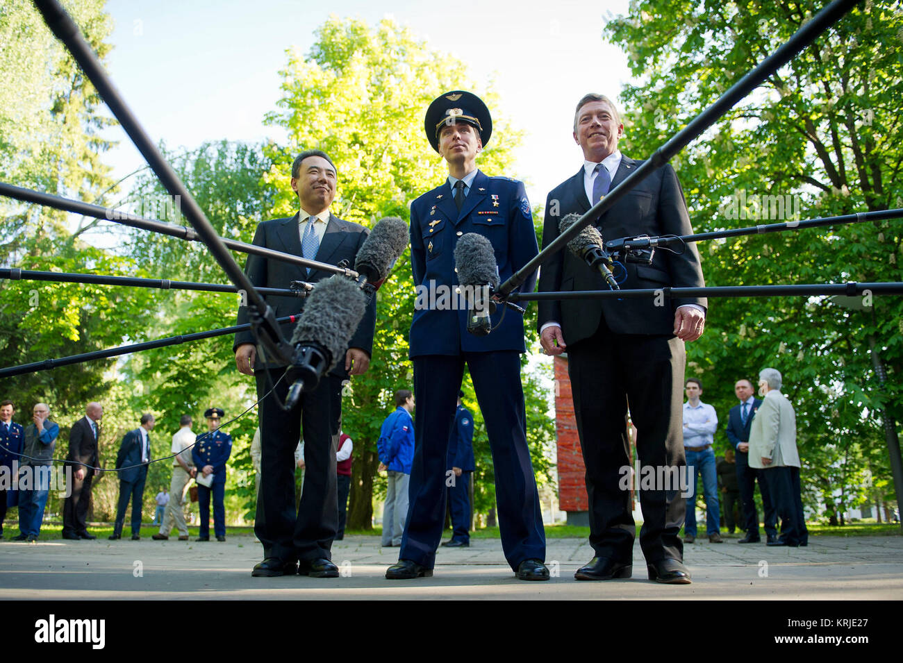 Expedition 28 crew members, Flight Engineer Satoshi Furukawa, left, Soyuz commander Sergei Volkov, center, and Flight Engineer Mike Fossum, answer reporters questions during a crew departure press conference held on the grounds of the Gagarin Cosmonaut Training Center, Wednesday, May 25, 2011 in Star City, Russia.  The crew later departed for Baikonur, Kazakhstan in preparation for their June launch onboard a Soyuz rocket.  Photo Credit: (NASA/Bill Ingalls) Expedition 28 Crew Departs Star City Stock Photo