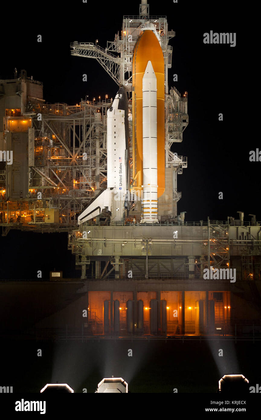 The space shuttle Atlantis is seen shortly after the rotating service structure (RSS) was rolled back at launch pad 39a, Thursday, July 7, 2011 at the NASA Kennedy Space Center in Cape Canaveral, Fla.  Atlantis is set to liftoff Friday, July 8, on the final flight of the shuttle program, STS-135, a 12-day mission to the International Space Station.  Photo Credit: (NASA/Bill Ingalls) STS-135 (side view) on rotating service structure Stock Photo