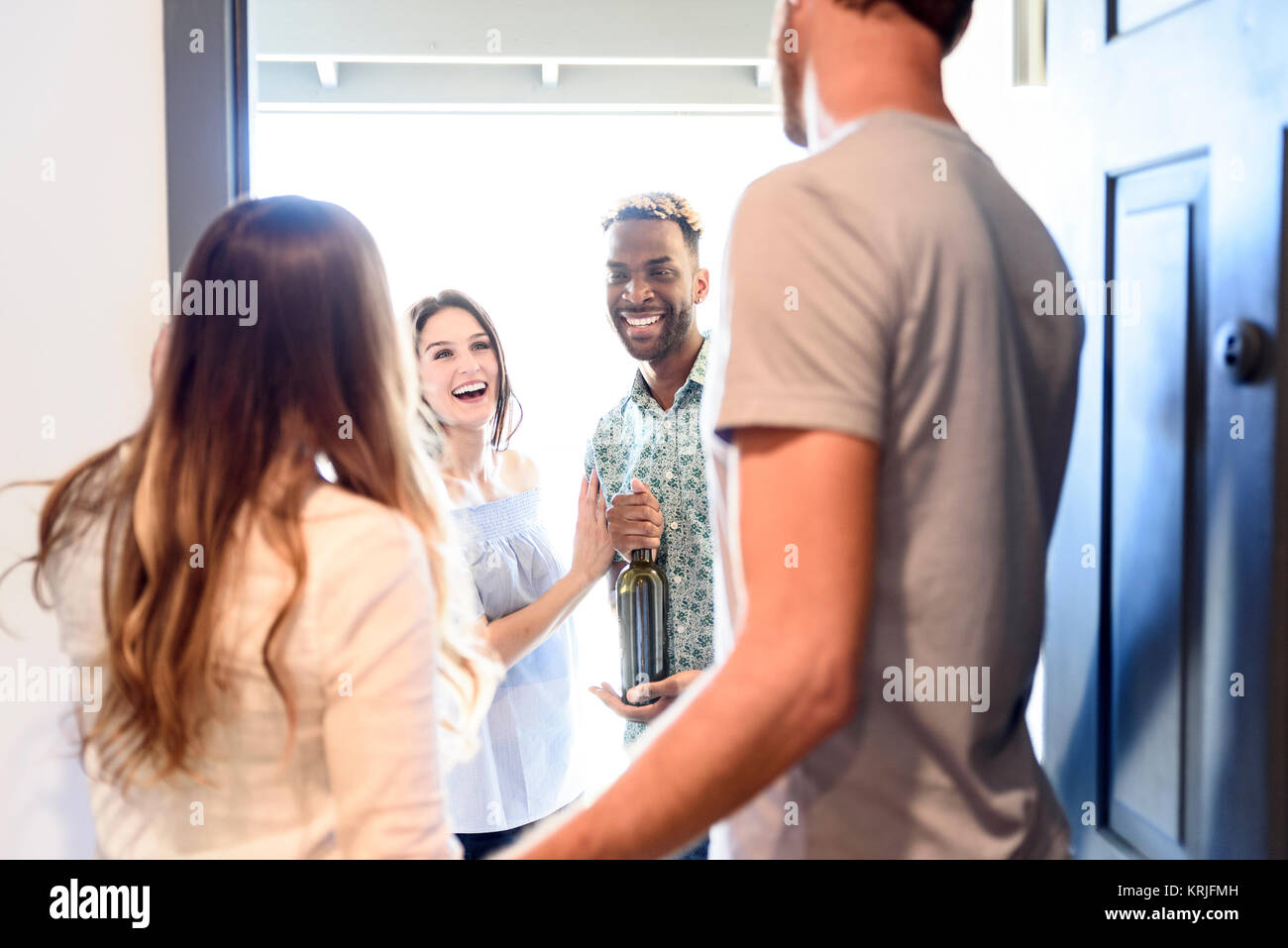 Couple greeting friend hi-res stock photography and images - Alamy