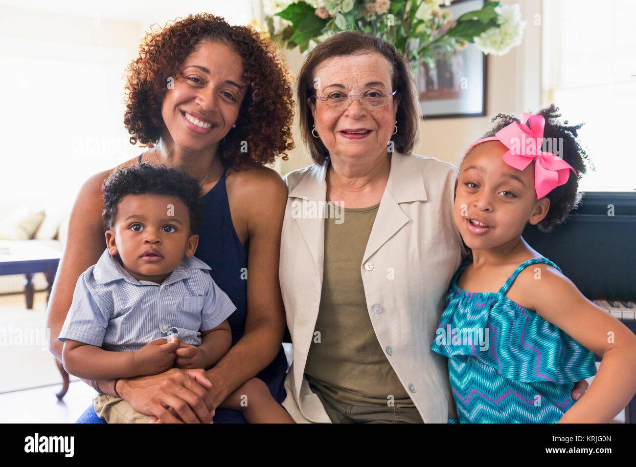 Portrait of smiling mixed race multi-generation family Stock Photo