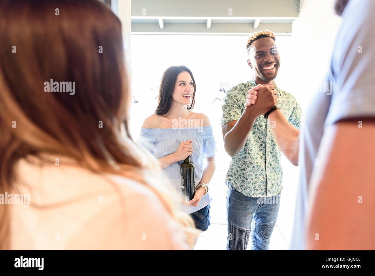 Greeting friend at the door hi-res stock photography and images - Alamy