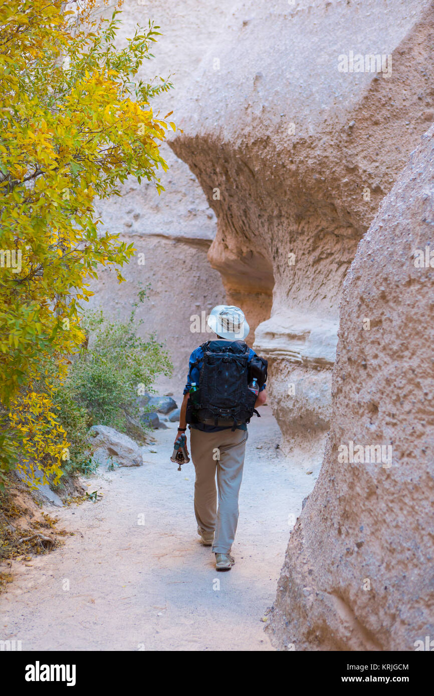 Caucasian man hiking near boulders Stock Photo