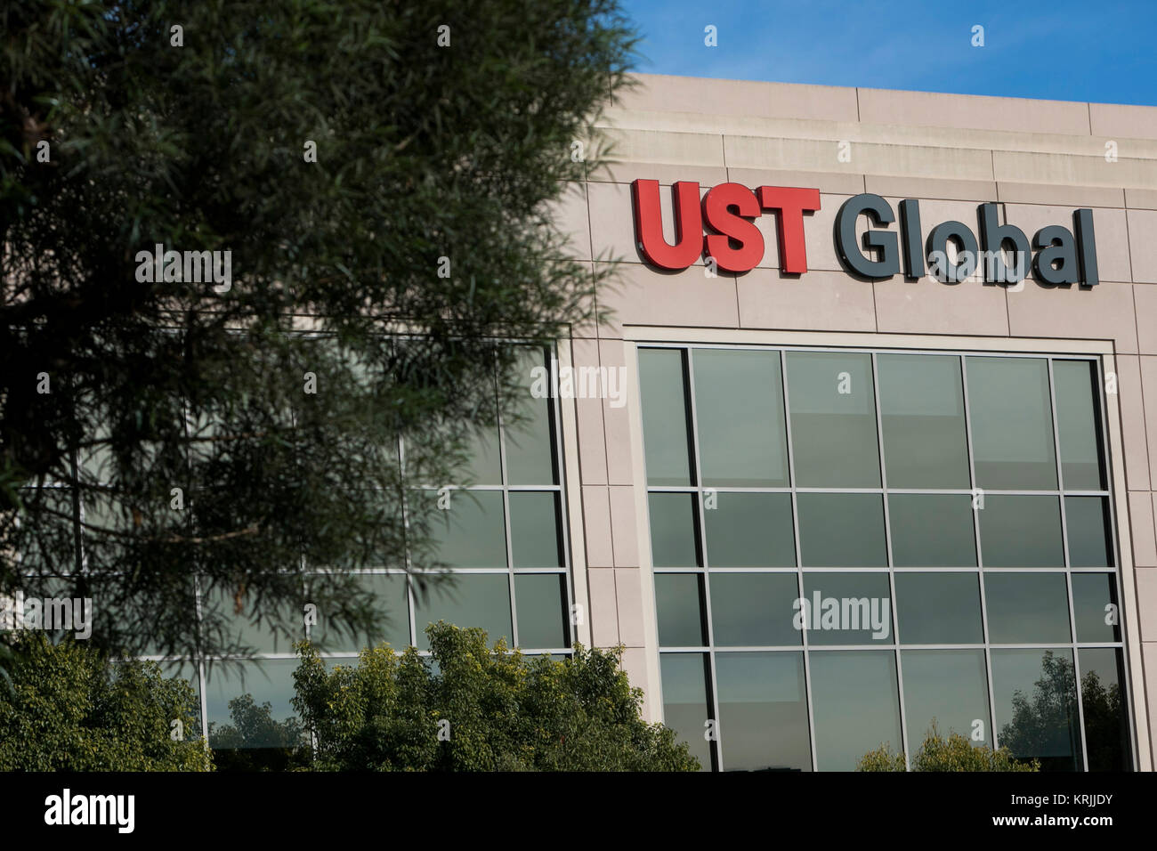 A logo sign outside of the headquarters of UST Global in Aliso Viejo ...