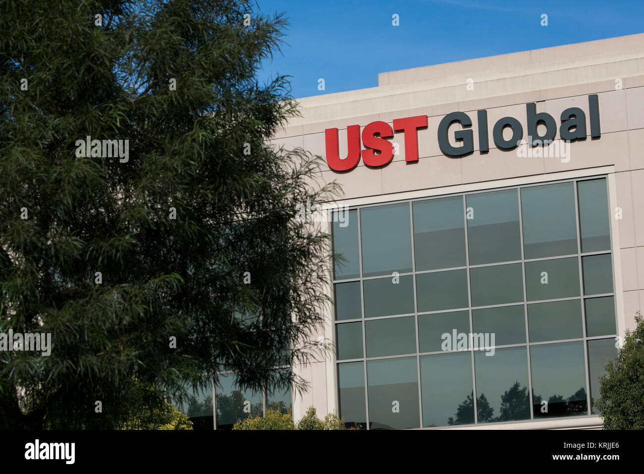 A logo sign outside of the headquarters of UST Global in Aliso Viejo