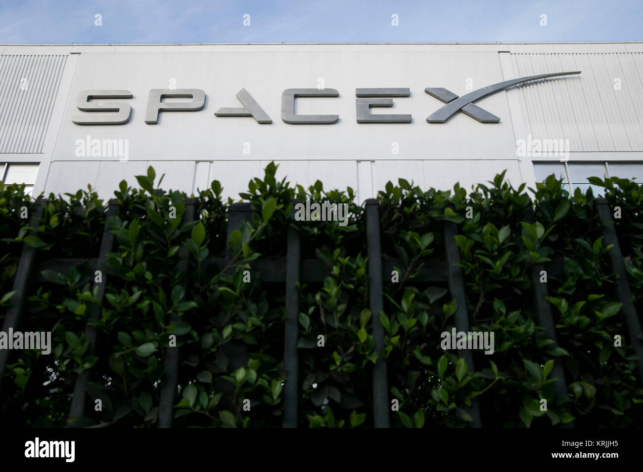 A logo sign outside of the headquarters of Space Exploration Technologies Corp., also known as SpaceX, in Hawthorne, California, on December 10, 2017. Stock Photo