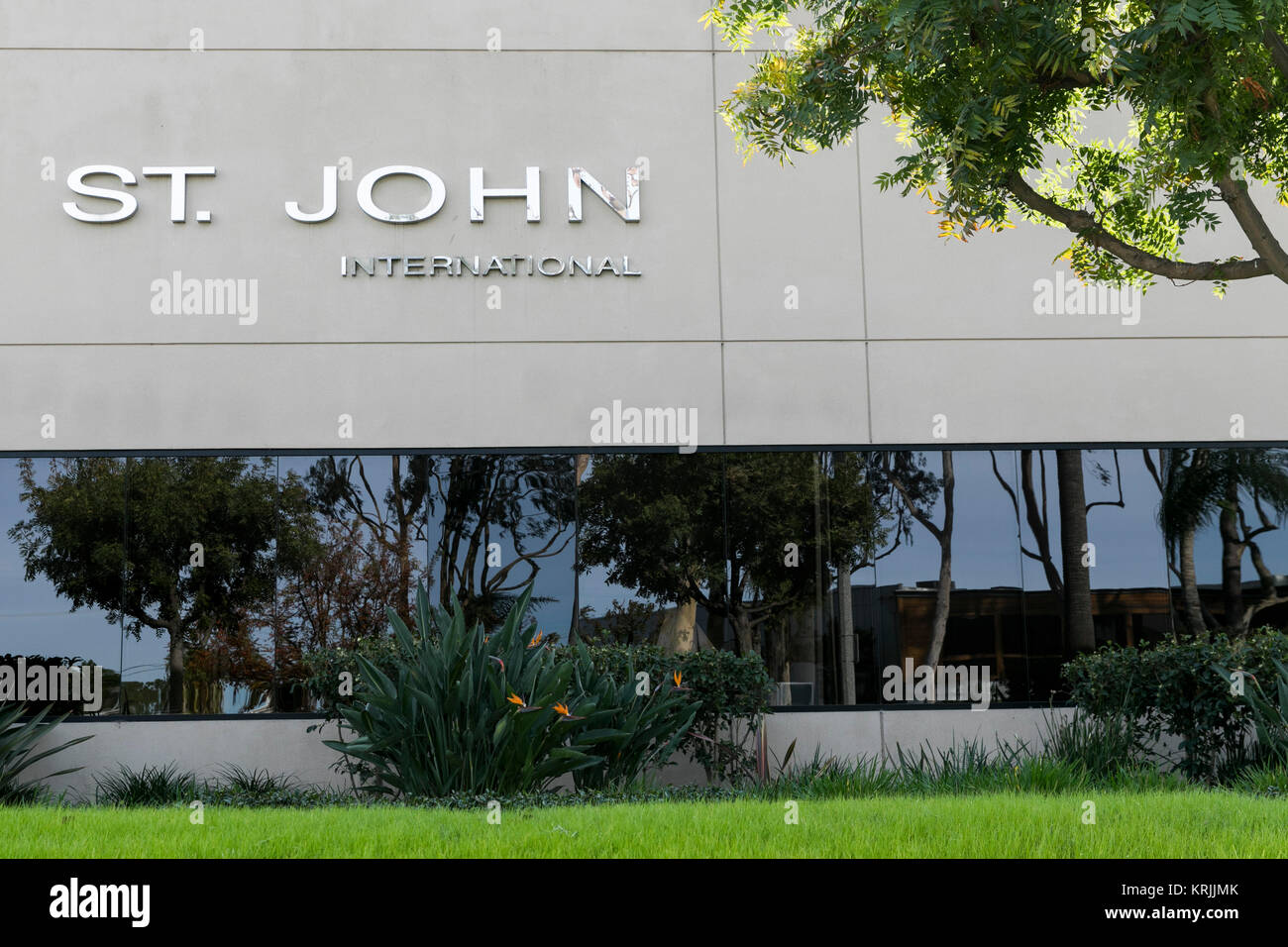A logo sign outside of the headquarters of St. John Knits International