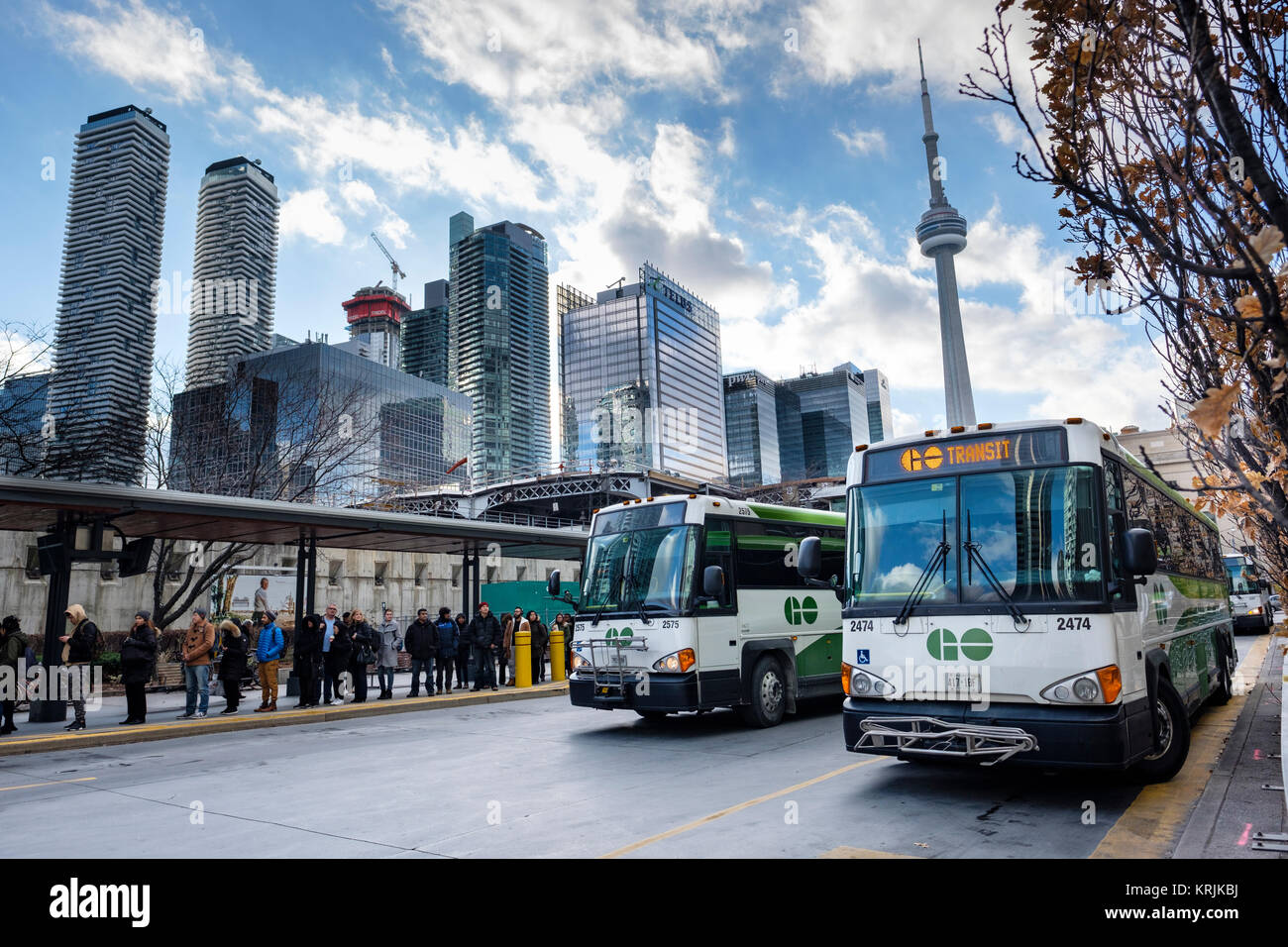 Union Station Bus Terminal, passengers lined-up to board Go buses used for public transportation of commuters living in the GTA region, Toronto. Stock Photo