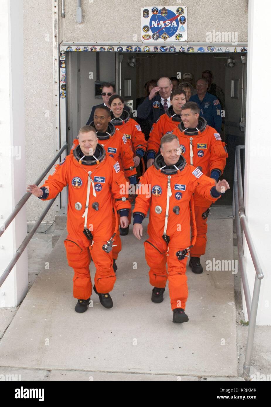 NASA International Space Station Space Shuttle Discovery STS-133 mission prime crew astronauts (left, front to back) Eric Boe, Alvin Drew, Nicole Stott, (right, front to back) Steve Lindsey, Steve Bowman, and Michael Barratt leave the Kennedy Space Center Operations and Checkout Building in preparation for launch February 24, 2011 in Merritt Island, Florida. Stock Photo