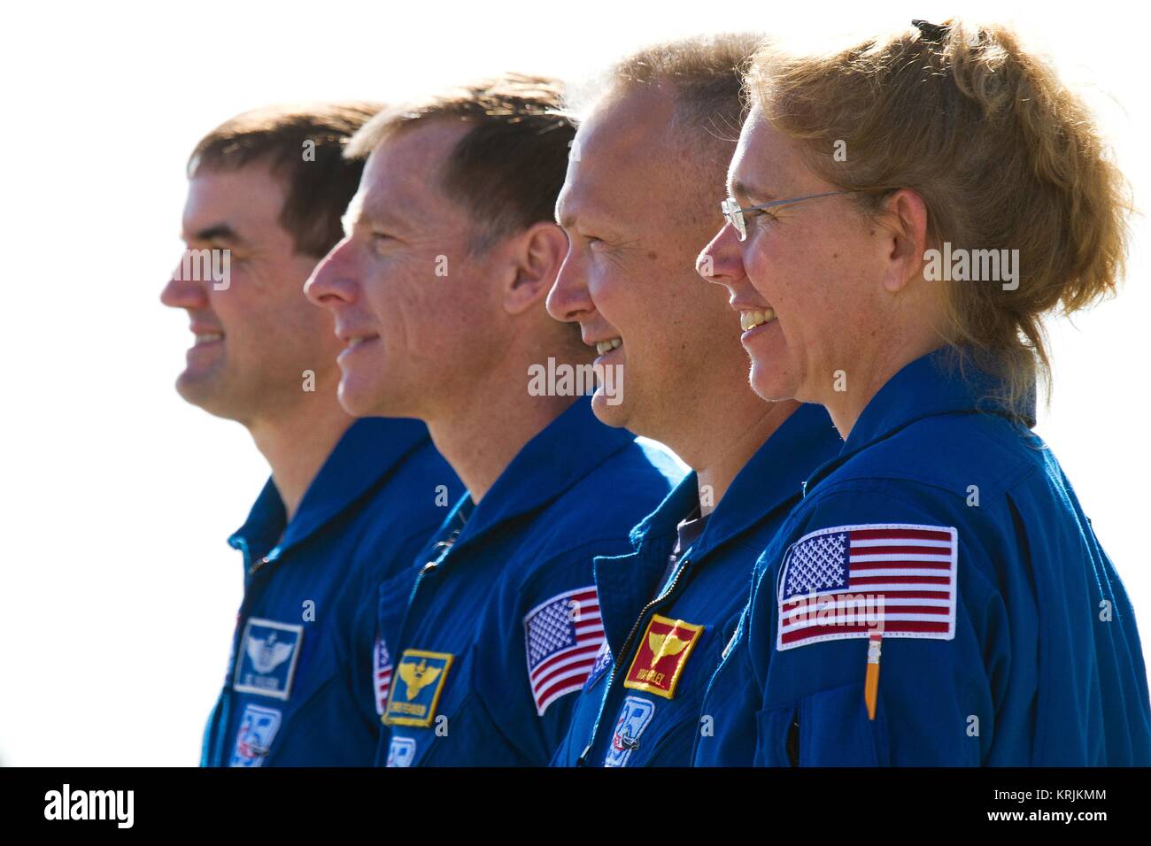 NASA International Space Station Space Shuttle Atlantis STS-135 mission prime crew astronauts (L-R) Rex Walheim, Chris Ferguson, Doug Hurley, and Sandy Magnus watch the Atlantis roll out from the Kennedy Space Center Orbiter Processing Facility to the Vehicle Assembly Building May 17, 2011 in Merritt Island, Florida. Stock Photo