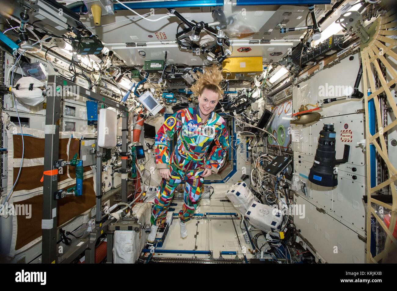 NASA International Space Station Expedition 49 prime crew member American astronaut Kate Rubins wears a hand-painted spacesuit decorated by cancer patients at the MD Anderson Cancer Center September 9, 2016 in Earth orbit. Stock Photo