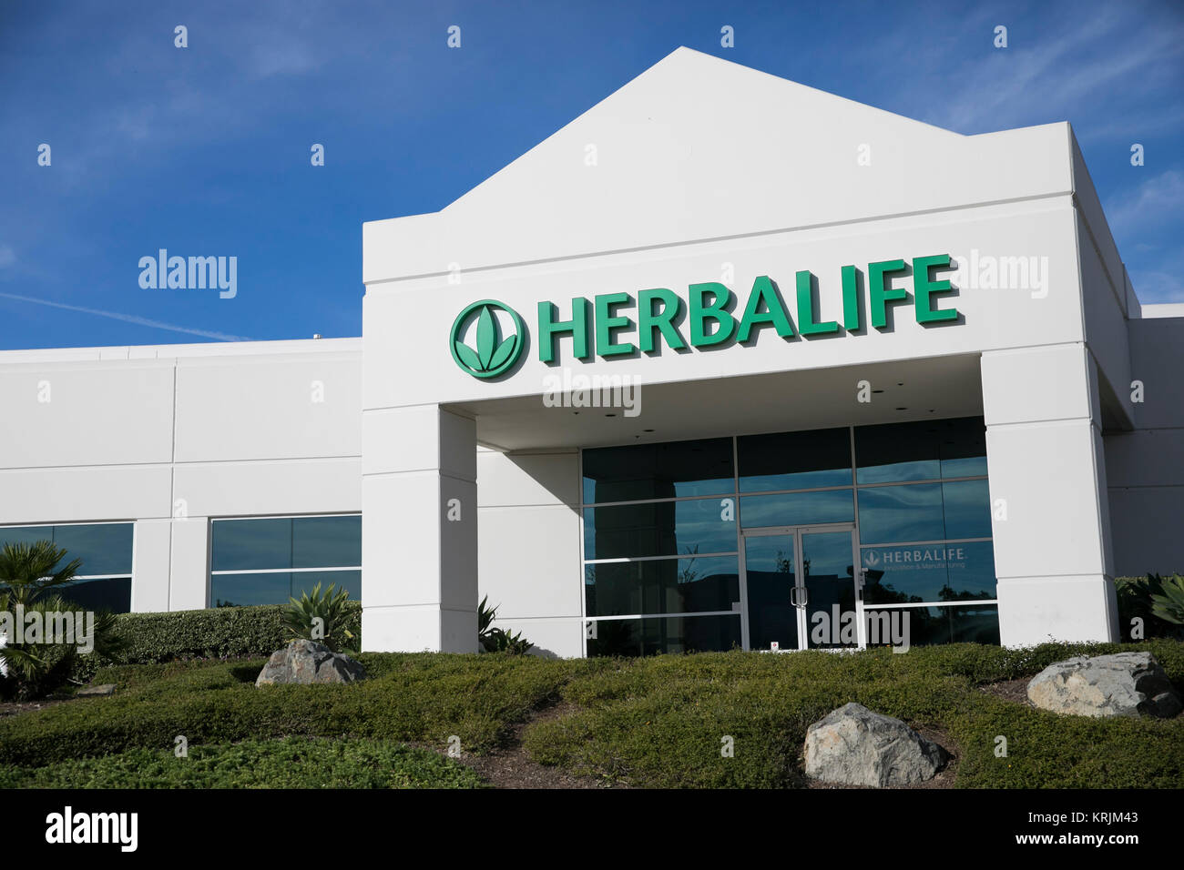 A Logo Sign Outside Of A Facility Occupied By Herbalife International ...