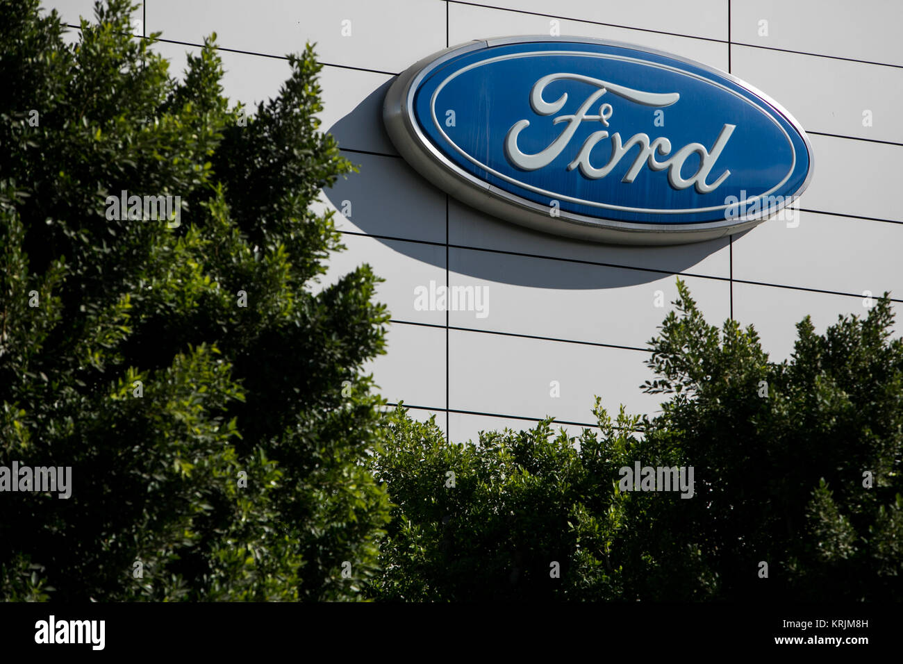 A logo sign outside of a facility occupied by The Ford Motor Company in ...