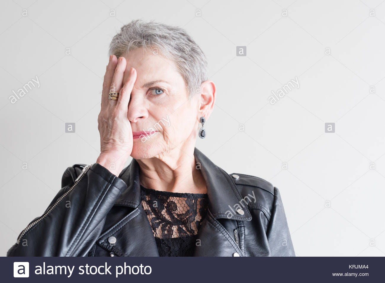 Head And Shoulders View Of Beautiful Older Woman With Short