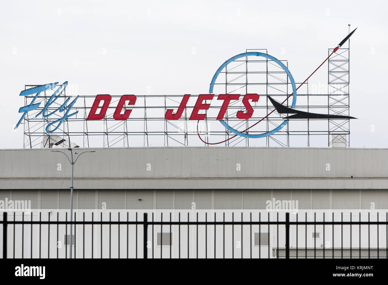 A 'Fly DC Jets' neon logo sign outside of the former Boeing 717 Jet Aircraft factory in Long Beach, California, on December 10, 2017. Stock Photo