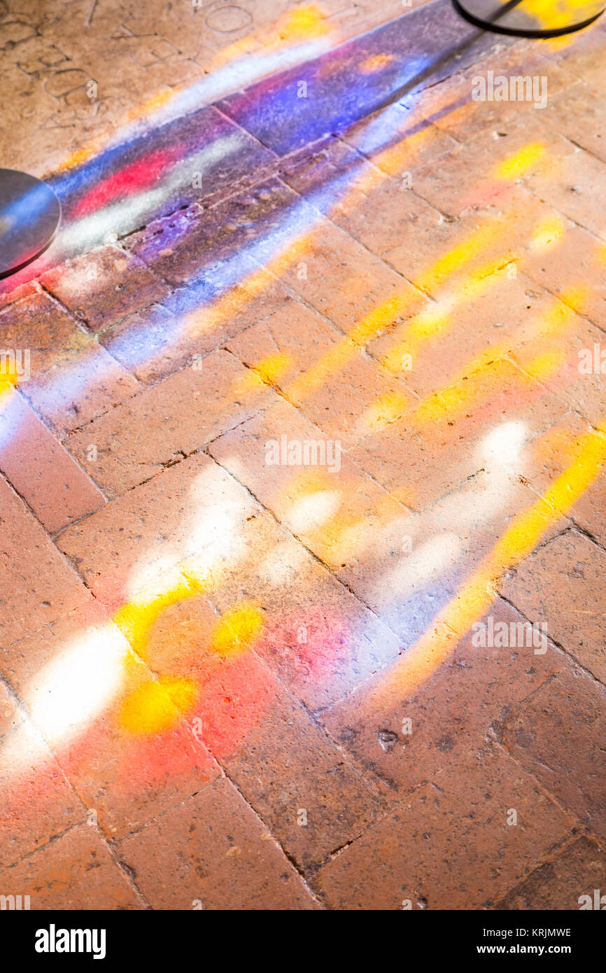 Colorful light spots on the the floor in church Stock Photo