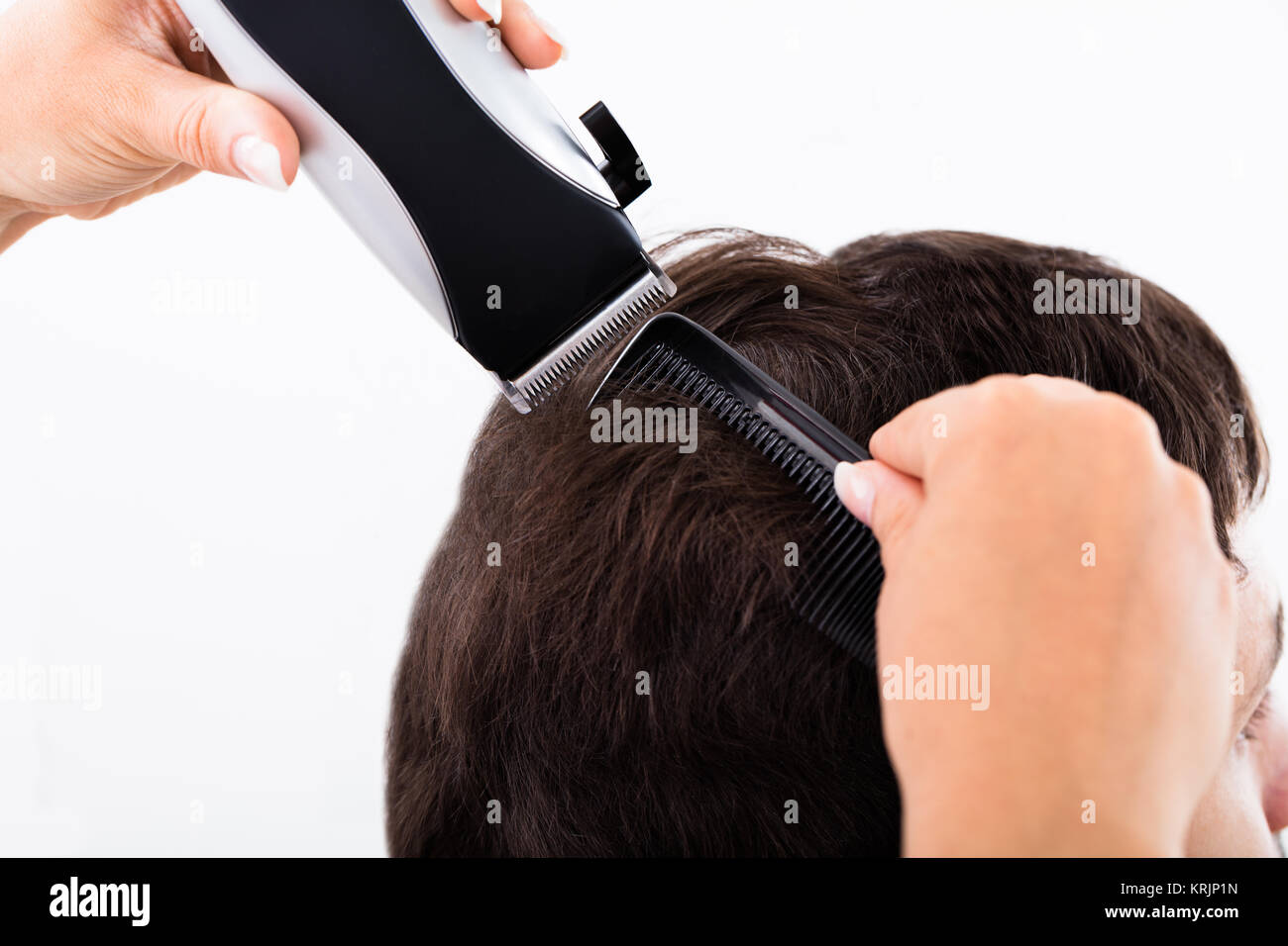 Hairdresser Cutting Man's Hair With Electric Trimmer Stock Photo Alamy