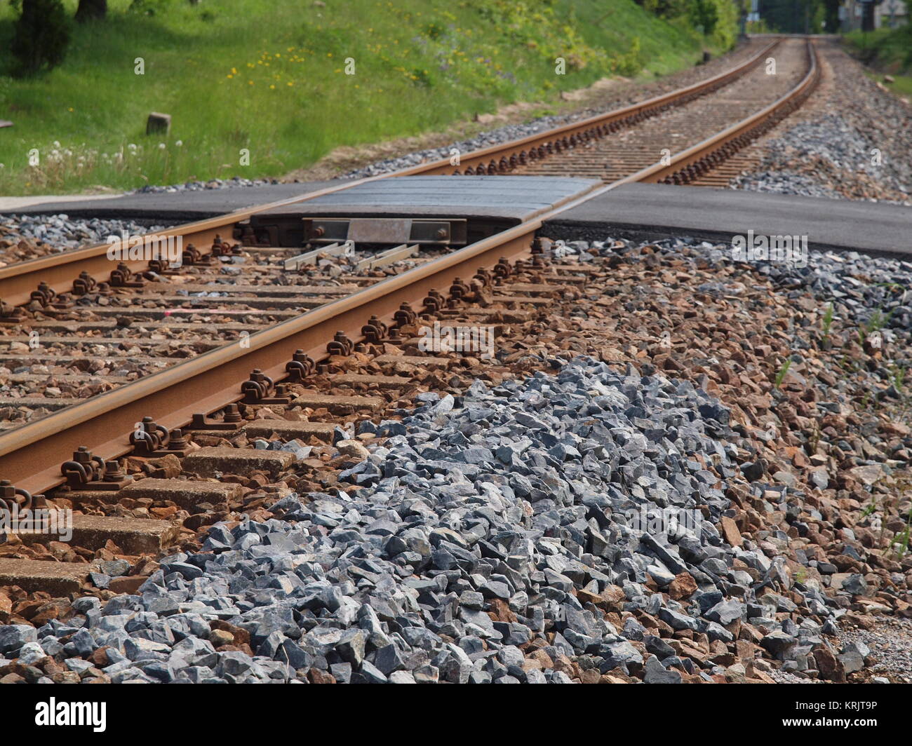 German text Streik (meaning strike) over rusty metal railway tracks and  brackets in a ballast bed, selected focus, narrow depth of field Stock  Photo - Alamy