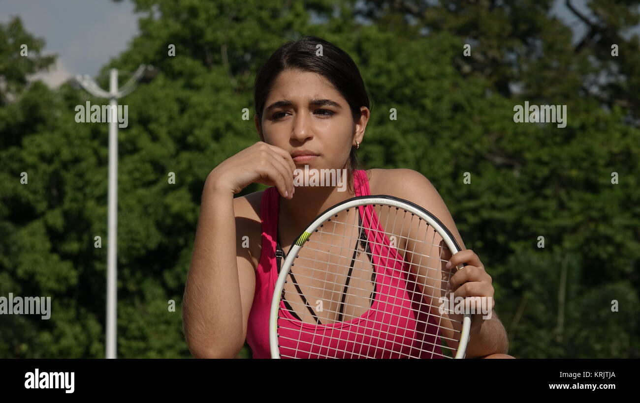 Girl Teenager Tennis Player Wondering Stock Photo
