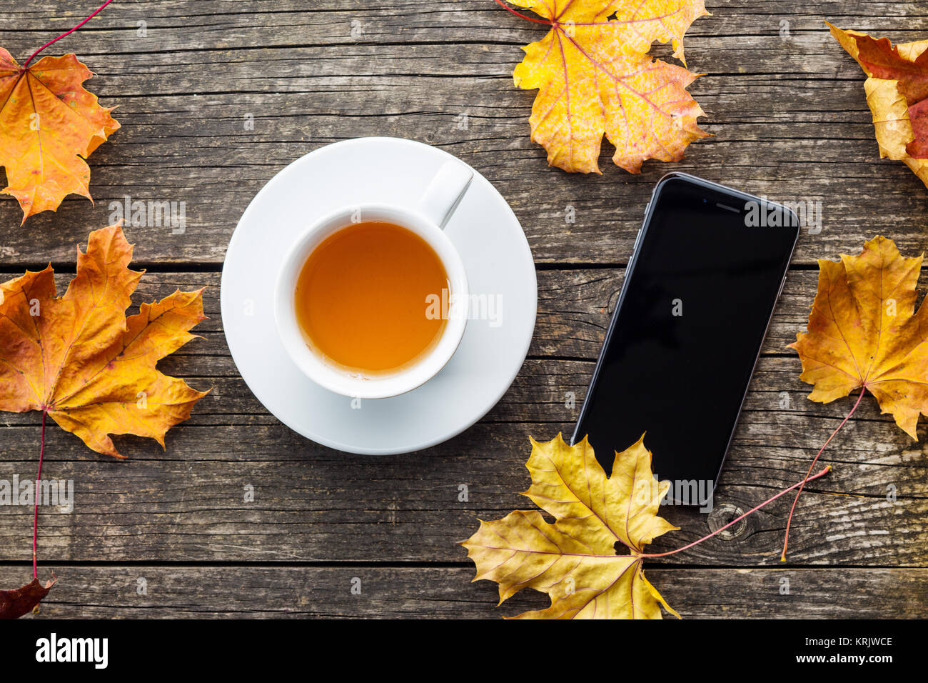 Cup of tea and smartphone Stock Photo - Alamy