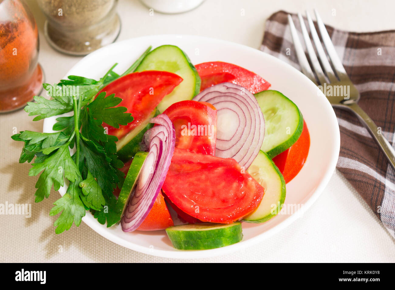 Salad with tomatoes and cucumbers Stock Photo - Alamy