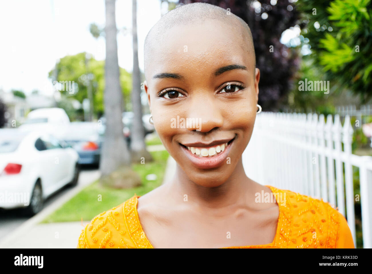 Portrait of bald smiling Black woman Stock Photo