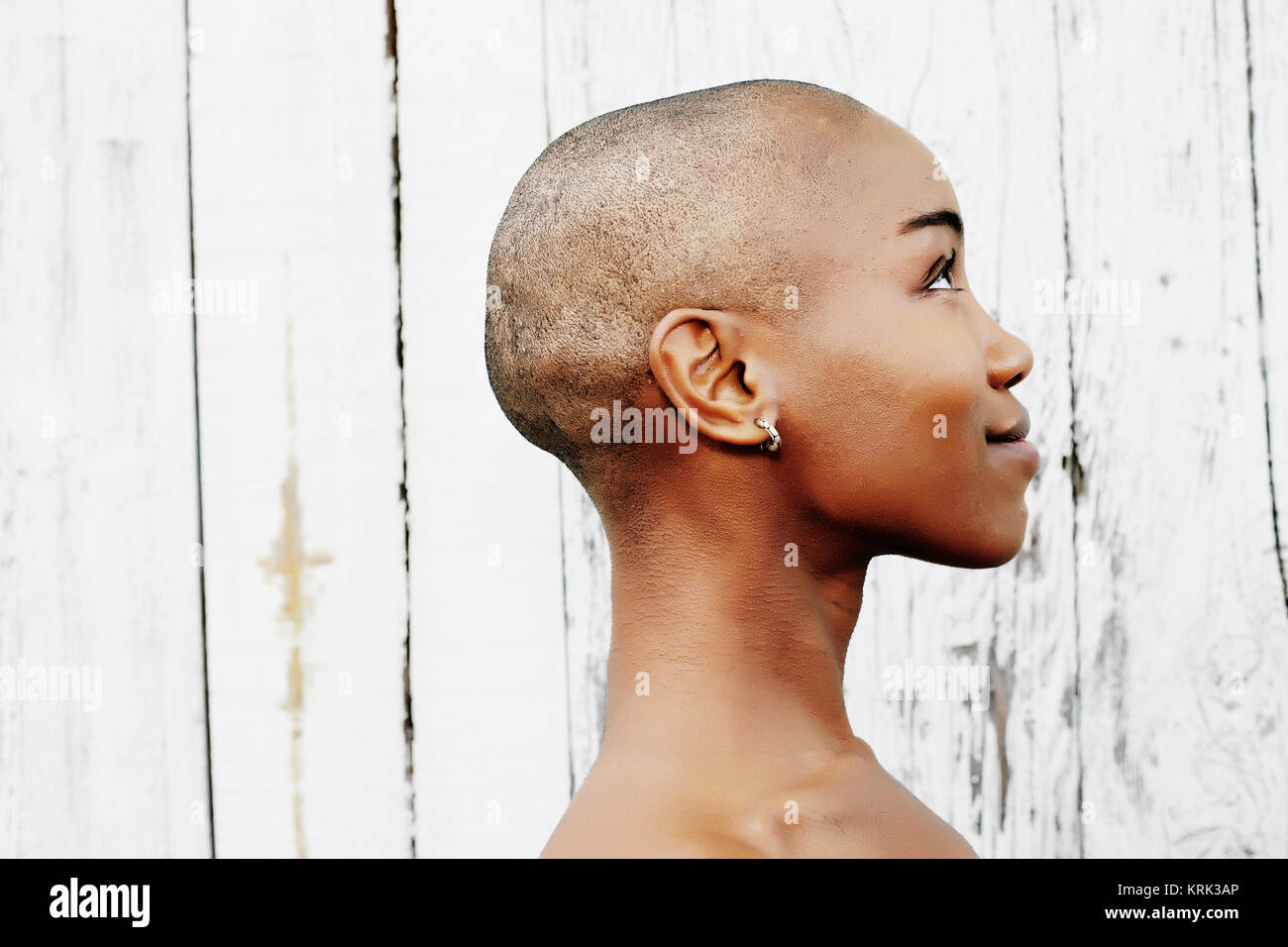 Profile of naked bald black woman Stock Photo