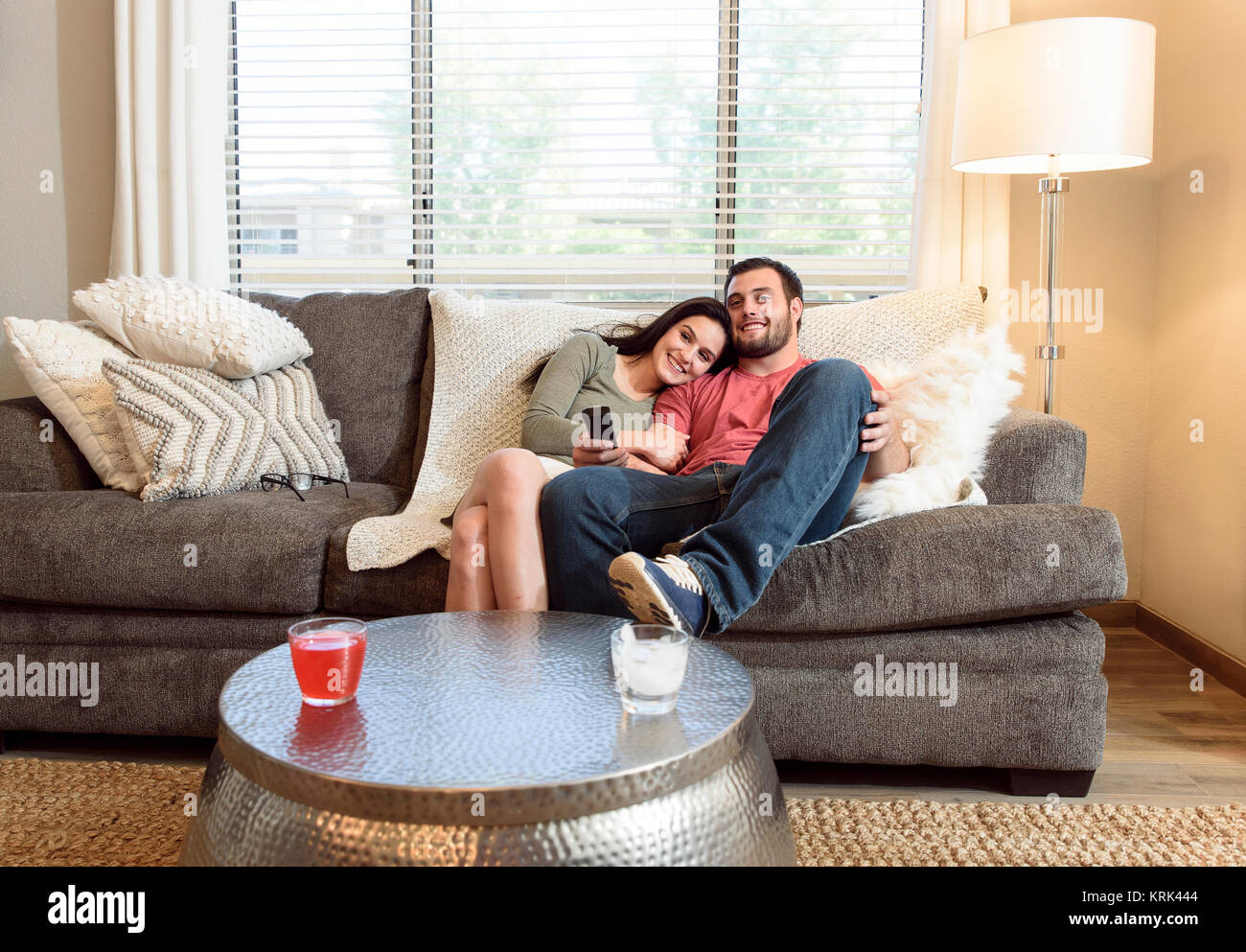 couple cuddling on couch