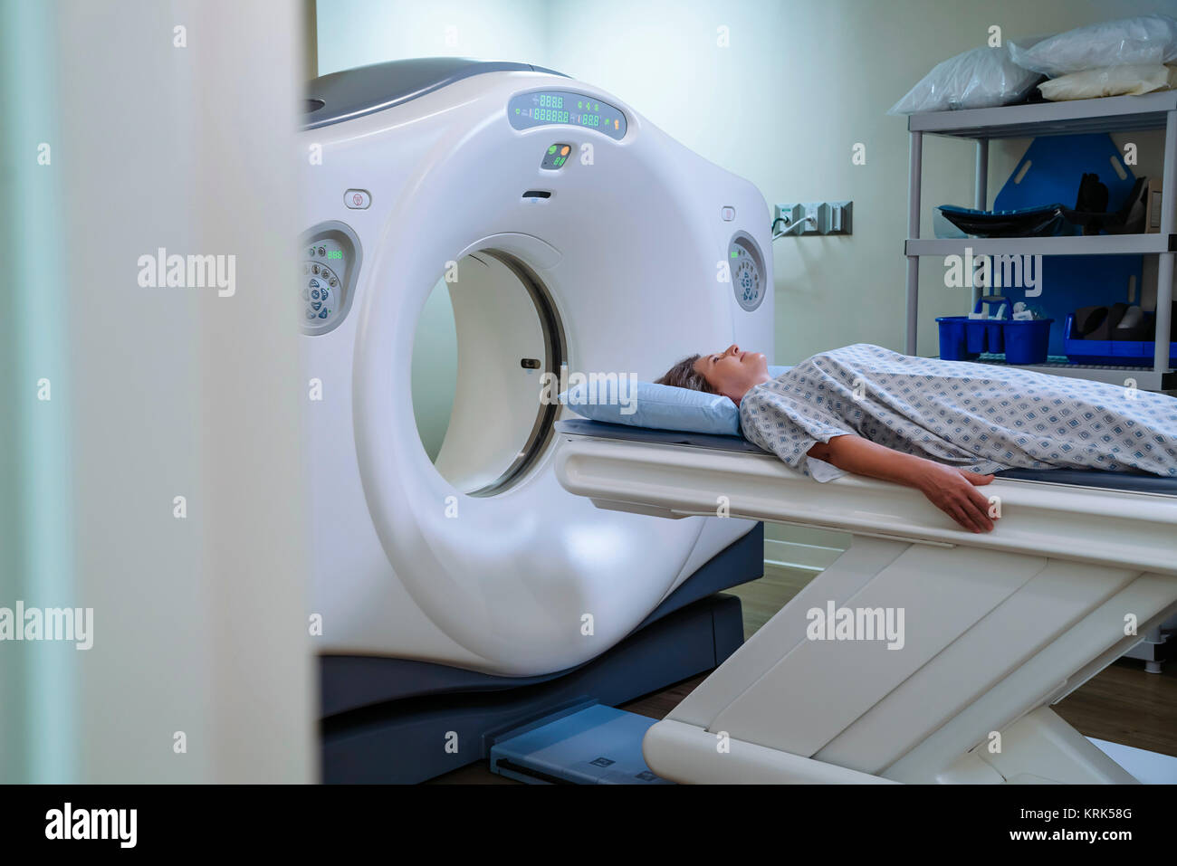 Caucasian patient laying on scanner table Stock Photo