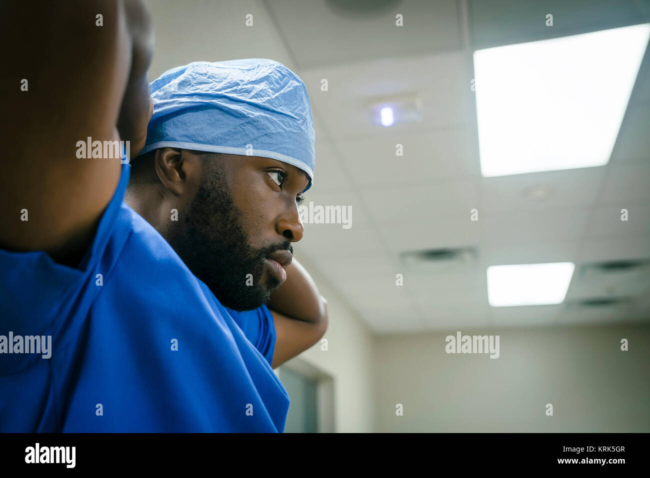 Black doctor wearing surgical cap Stock Photo