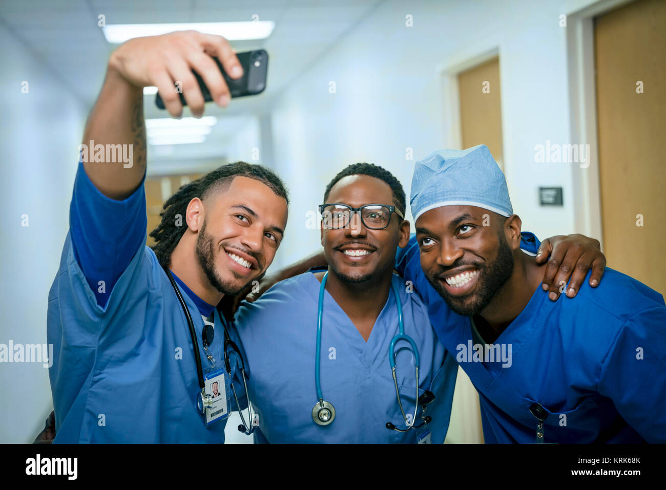 Smiling nurses posing for cell phone selfie Stock Photo