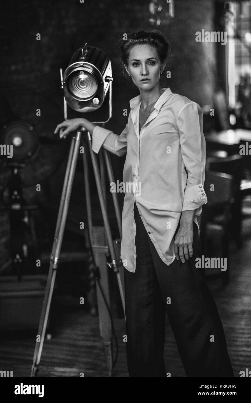 Serious black woman standing back Black and White Stock Photos & Images ...