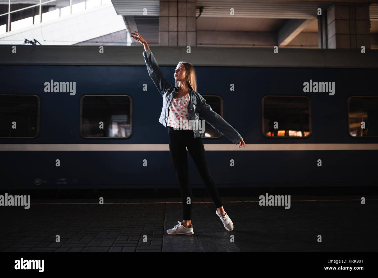 Caucasian woman dancing near train Stock Photo Alamy