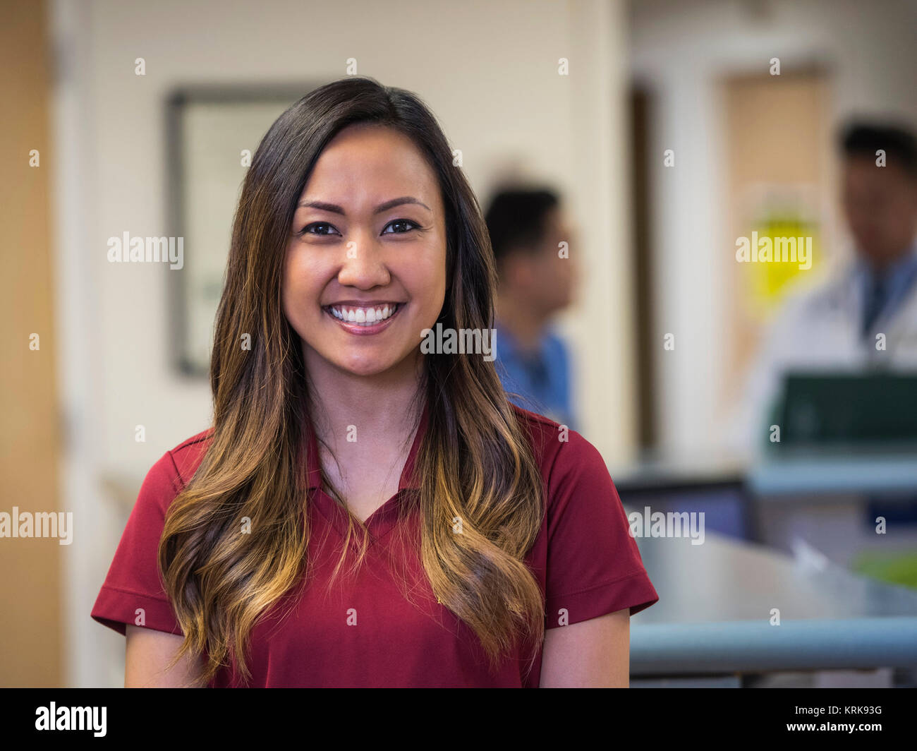Portrait of smiling nurse in hospital Stock Photo