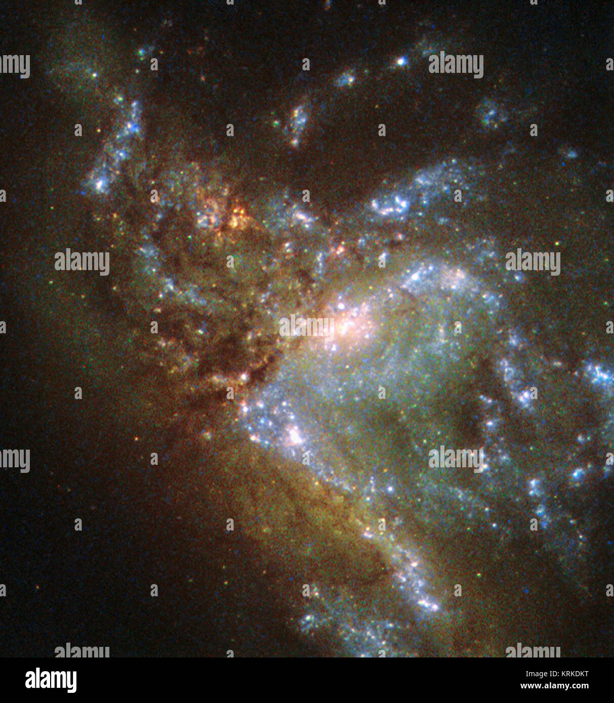 This image, taken with the Wide Field Planetary Camera 2 on board the NASA/ESA Hubble Space Telescope, shows the galaxy NGC 6052, located around 230 million light-years away in the constellation of Hercules. It would be reasonable to think of this as a single abnormal galaxy, and it was originally classified as such. However, it is in fact a “new” galaxy in the process of forming. Two separate galaxies have been gradually drawn together, attracted by gravity, and have collided. We now see them merging into a single structure. As the merging process continues, individual stars are thrown out of Stock Photo