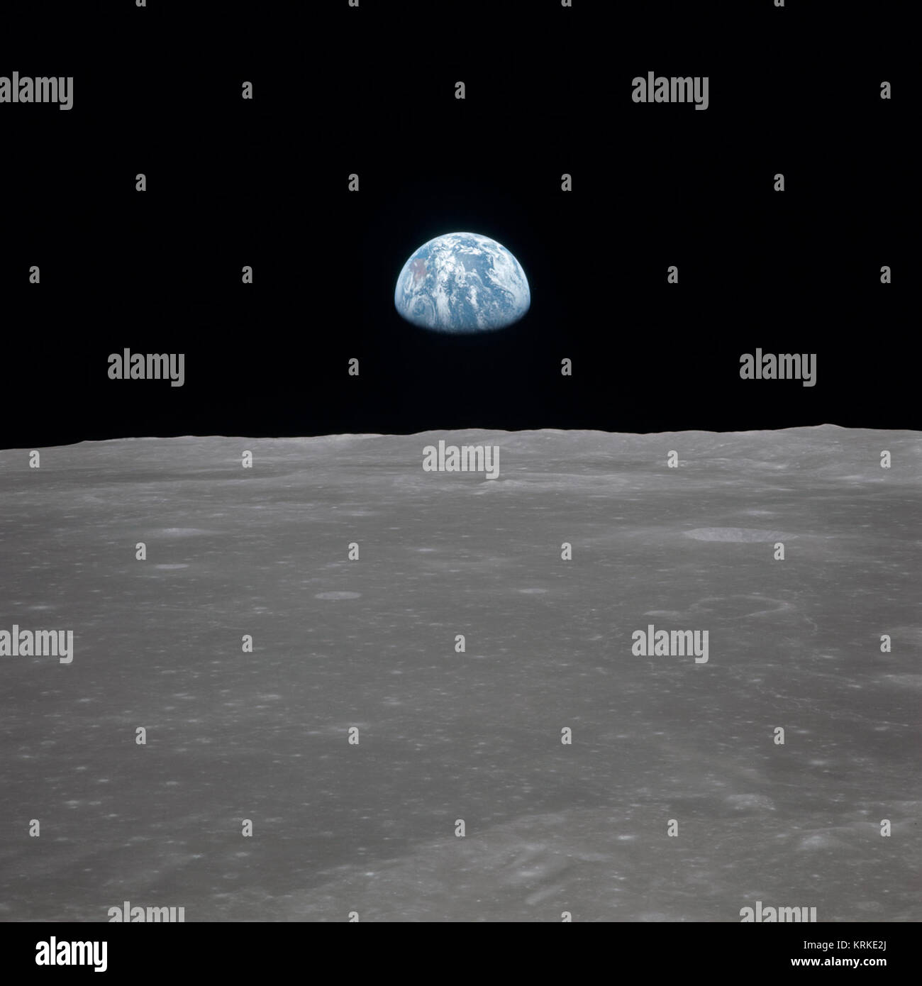 Earth Rises Over Lunar Horizon (AS11-44-6553) Stock Photo