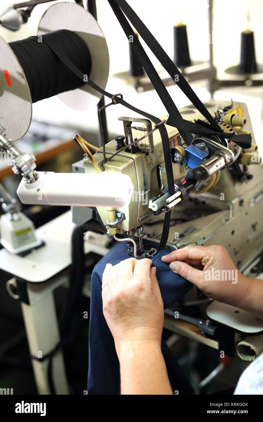 clothing production,sewing on a machine Stock Photo Alamy